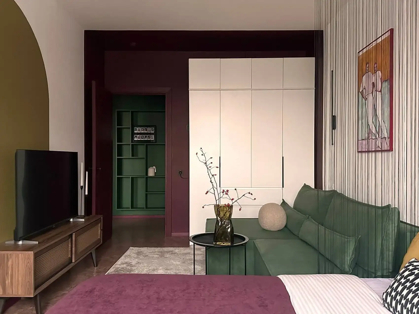 living room and bedroom with colour blocking in green and burgundy 37sqm studio contemporary decor living room and bedroom with colour blocking in green and burgundy 37sqm studio contemporary decor