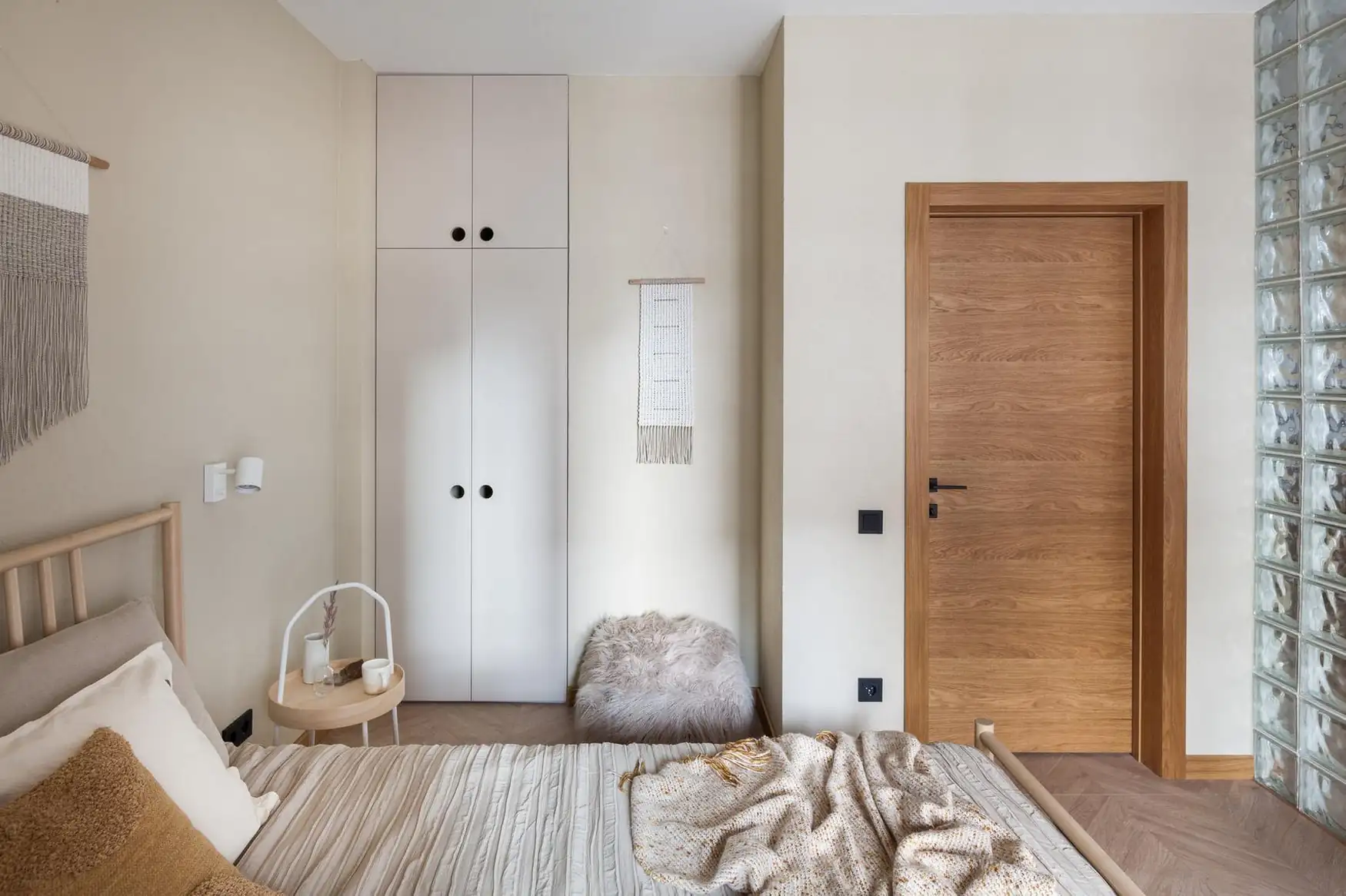 natural bedroom in 45sqm apartment with a glass brick partition natural bedroom in 45sqm apartment with a glass brick partition