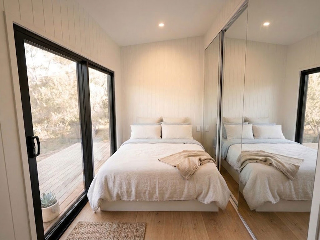bedroom with mirrored cupboards