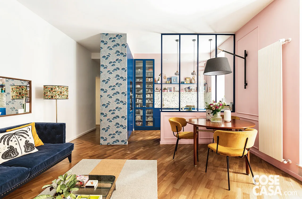 pink living room with blue sofa and semi glazed partition pink living room with blue sofa and semi glazed partition