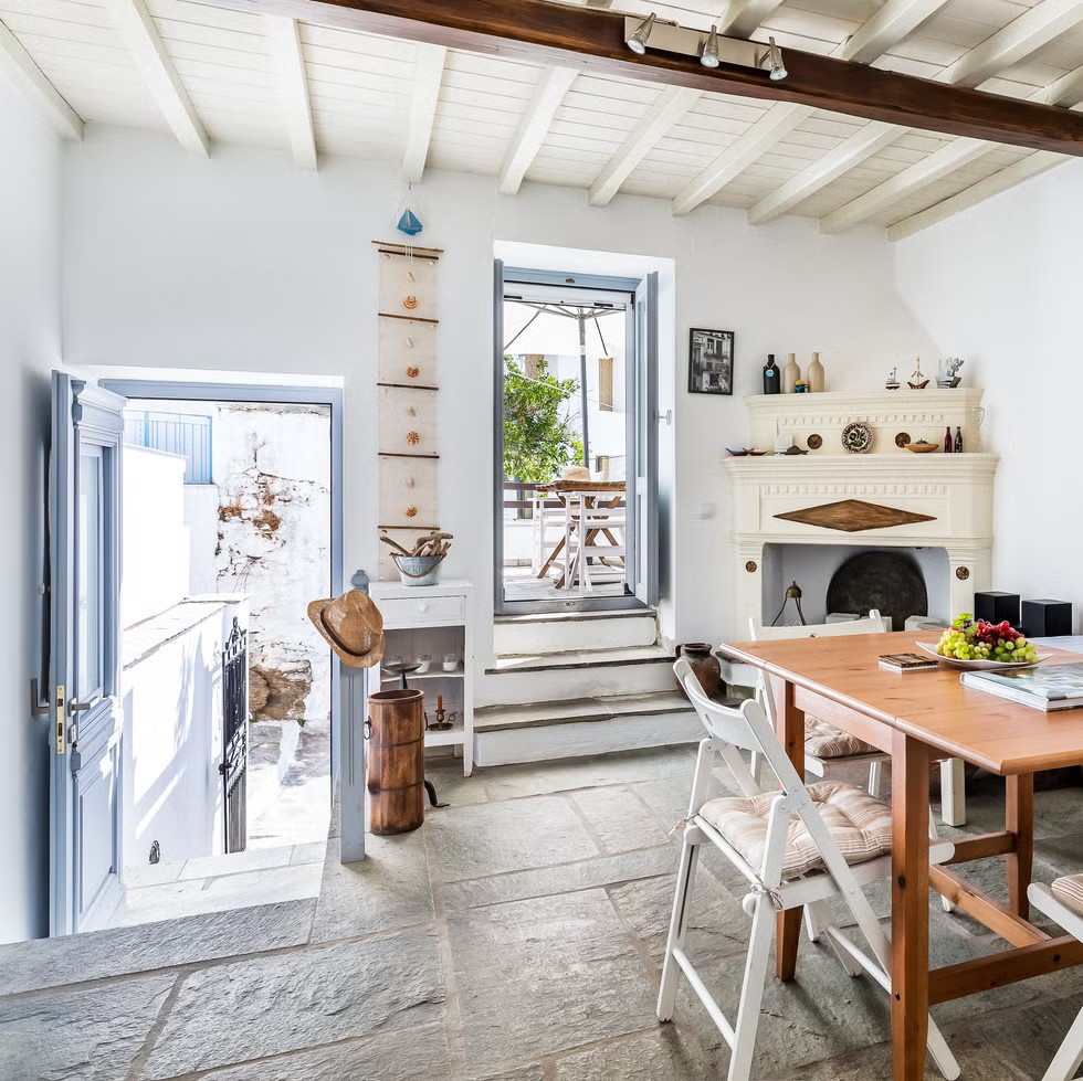 blue and white living room with historic fireplace house in Greece blue and white living room with historic fireplace house in Greece