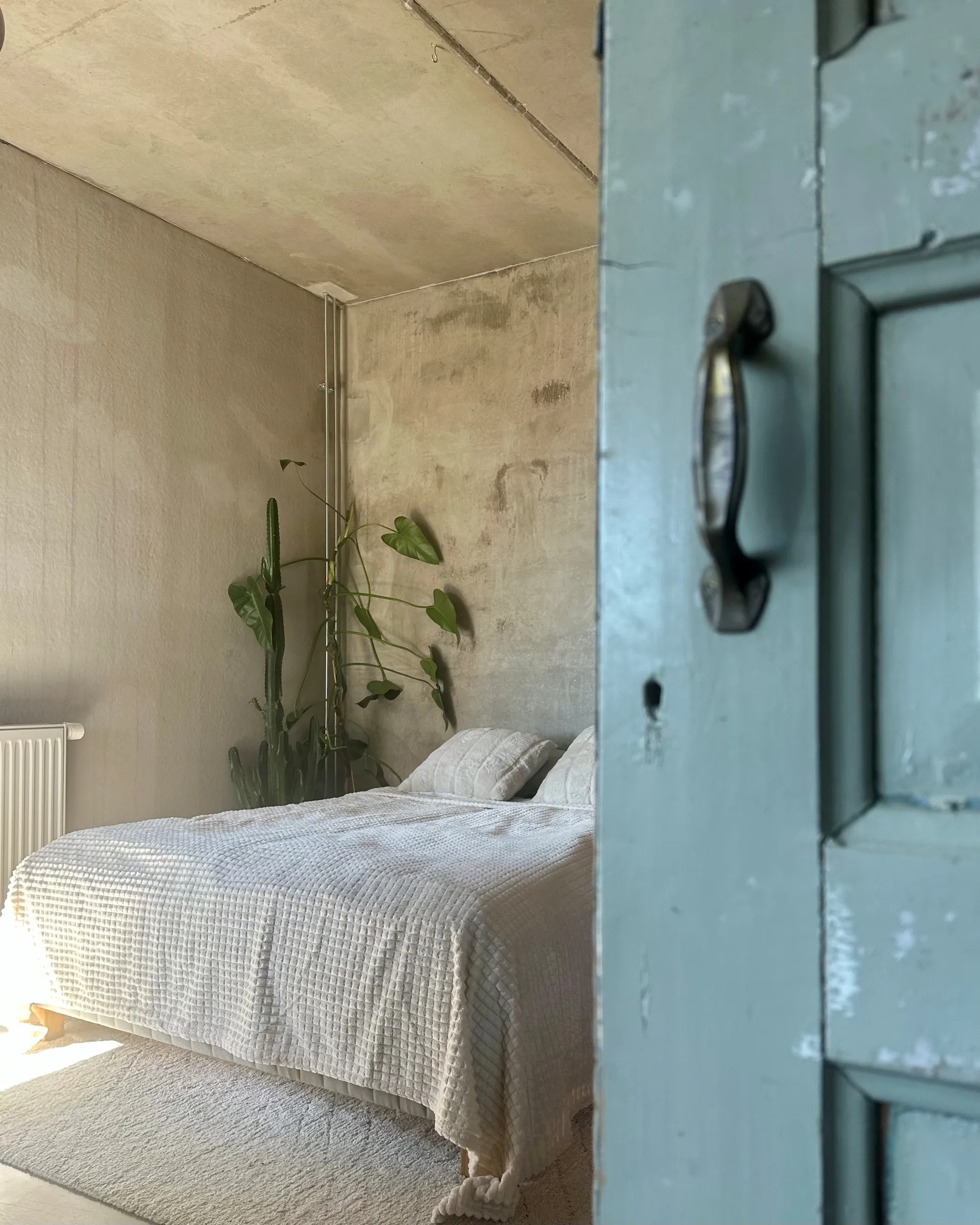 bedroom with concrete floor ceiling and walls bedroom with concrete floor ceiling and walls