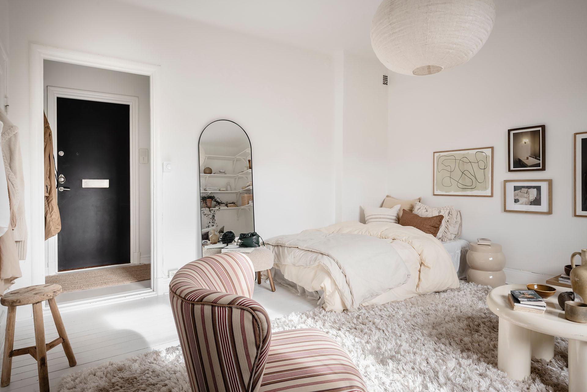 salon et coin chambre décoration scandinave blanche studio 27m2